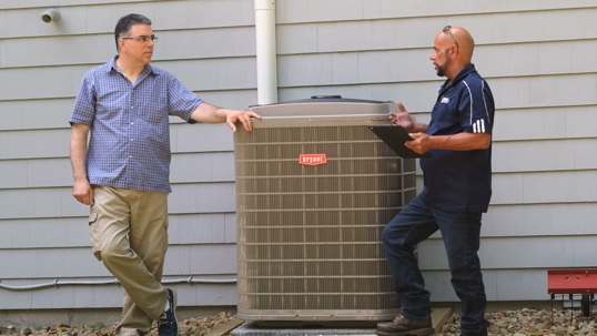 Men around an HVAC system